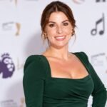 AI-edited illustrative portrait of Coleen Rooney wearing an emerald-green dress at a red-carpet-style event.